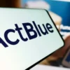 Mobile phone with logo of fundraising organization ActBlue Charities Inc.