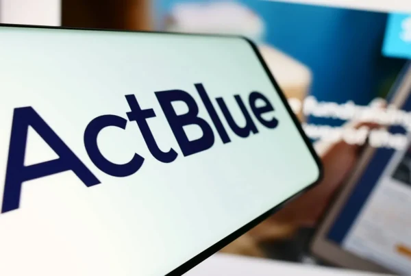Mobile phone with logo of fundraising organization ActBlue Charities Inc.