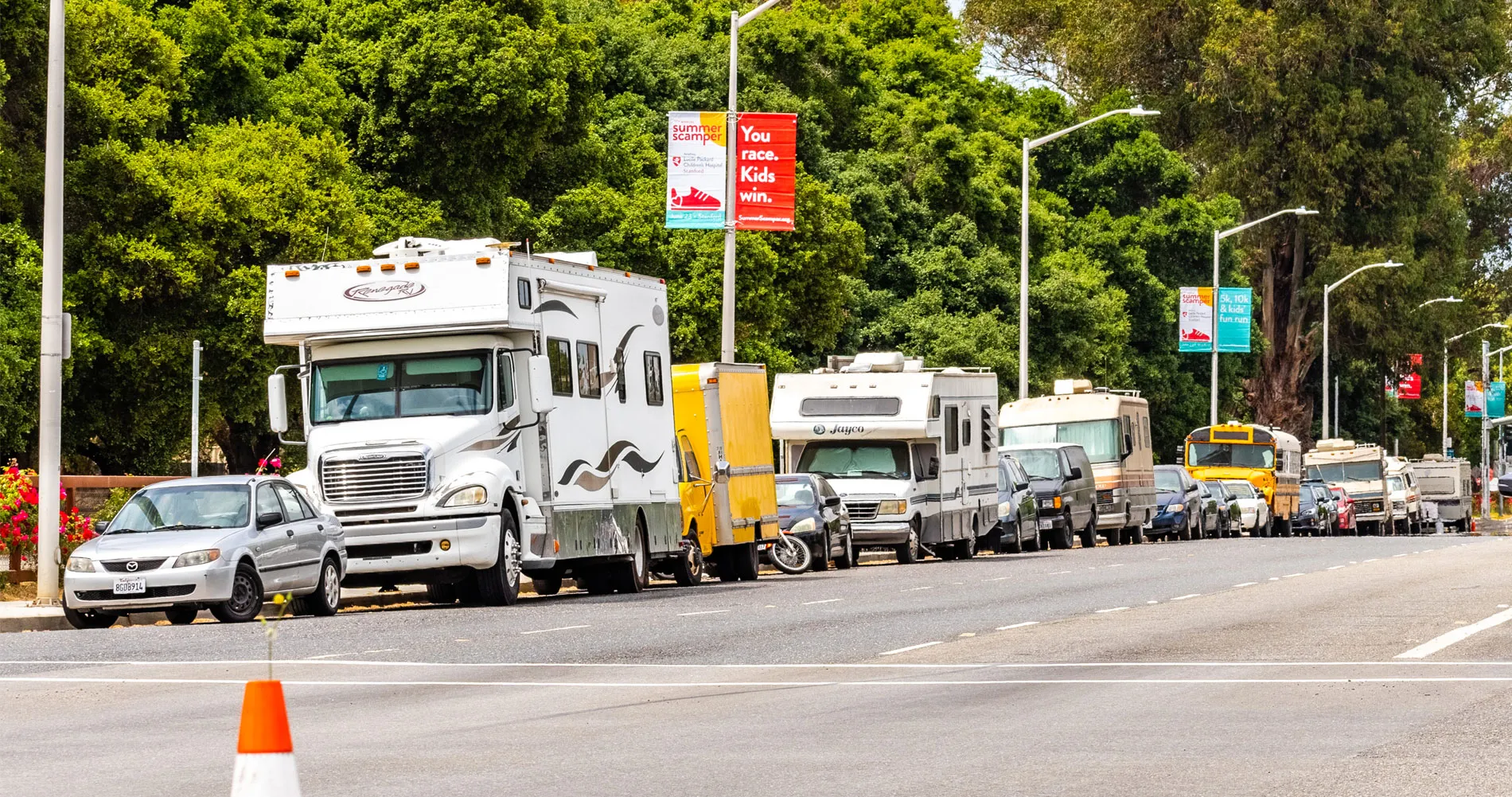 Campers and RVs parked on the side of El Camino Real