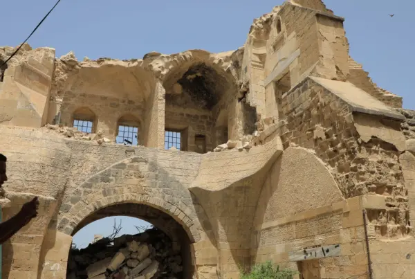 A Palestinian man inspects the historical site of Barquq Castle destroyed in the Gaza conflict - Israel