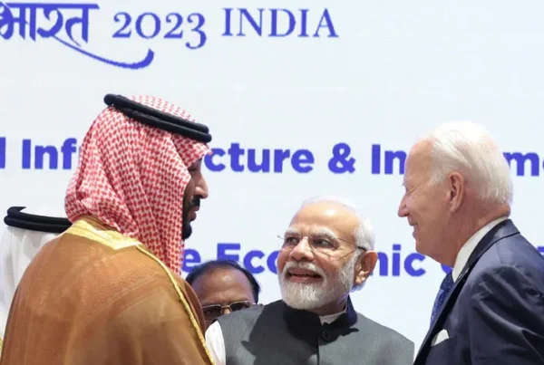 Indian Prime Minister Narendra, center, joins hands with U.S. President Joe Biden